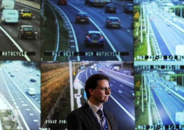 Highways Agency Project manager David Pilsworth in front of the screens showing the upgraded M62