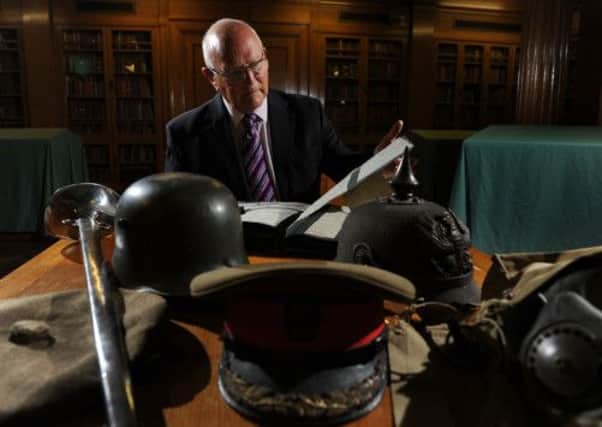 Dr Peter Liddle with some of the artefacts from the Liddle Collection at the Brotherton Library, Leeds University