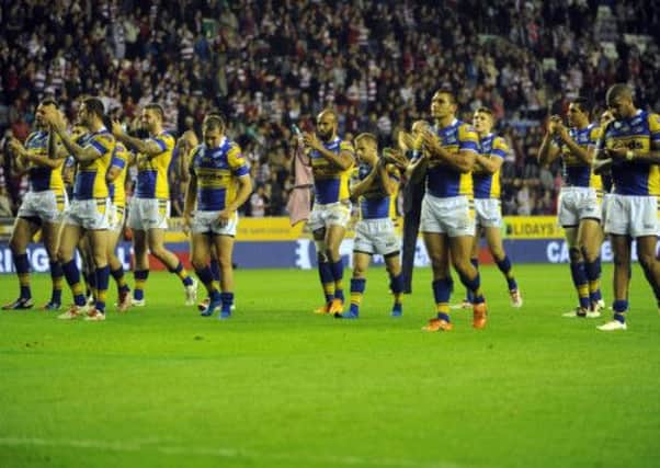 Leeds Rhinos' players show their appreciation to supporters at the end of a disappointing night. Picture: Steve Riding.