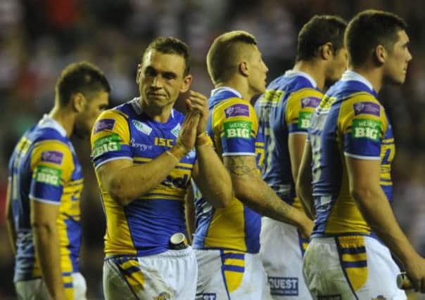 Leeds Rhinos' players show their disappointment after defeat to Wigan. Picture: Steve Riding.