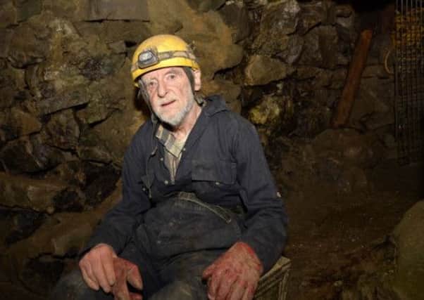Geoff Workman, the only living British record holder for staying underground, at Stump Cross Caverns in North Yorkshire