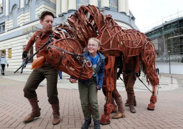Daniel Nielsen, 11, meets Joey, the life-size horse puppet from the National Theatres production