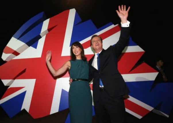 David Cameron with his wife Samantha following his keynote speech on the final day of the Conservative Party Conference