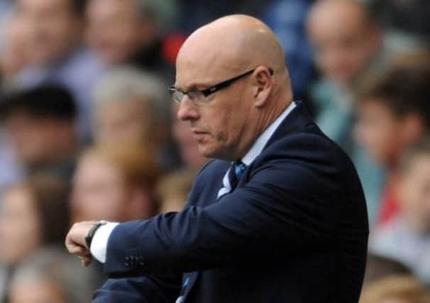 Leeds United's Manager Brian McDermott, counting down the minutes to the end of the match at The Den.
