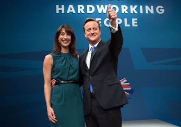 David Cameron with his wife Samantha following his keynote speech on the final day of the Conservative Party Conference