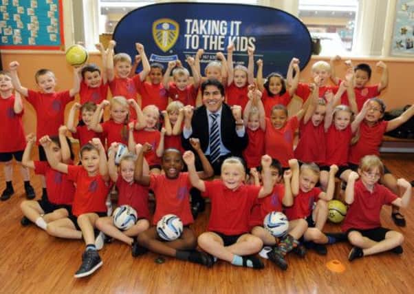 Leeds United chairman Salah Nooruddin visits children at Kirkstall St Stephens School