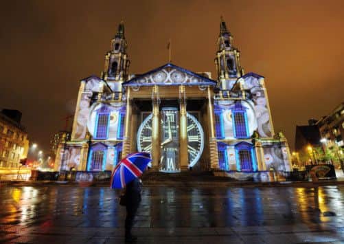 The Civic Hall in Leeds city centre is lit up by a giant outdoor projection entitled 'Momentous' by international artist group Illuminos