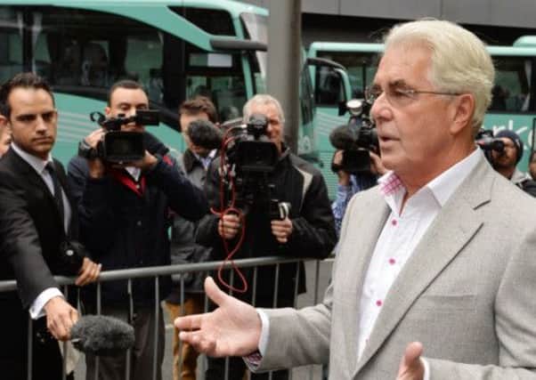 PR guru Max Clifford gives a statement to the media as he arrives at Southwark Crown Court