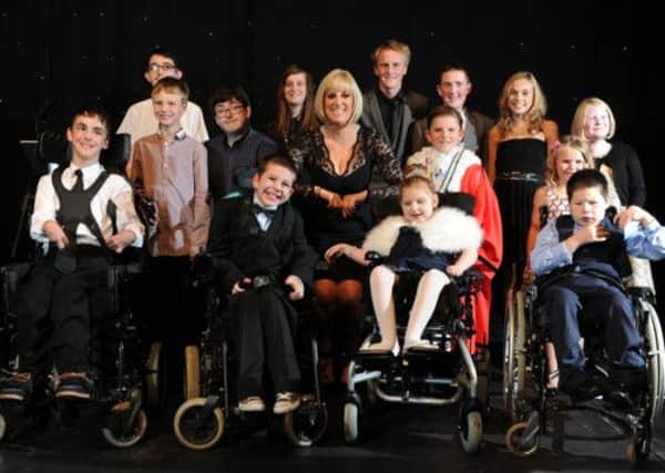 BBC's Stephanie McGovern and young comedy star Jack Carroll with the 2013 Children of Courage winners