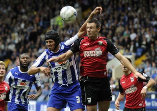 Owls' Miguel Llera on the attack.