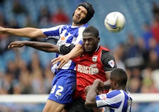 Owls pair Miguel Llera and Jose Semedo block out Town's Frank Nouble