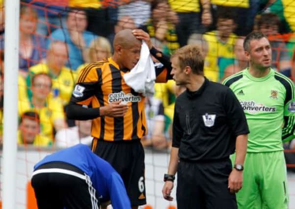 Hull City Tigers Curtis Davies holds his head during the Barclays Premier League match at the KC Stadium, Hull.