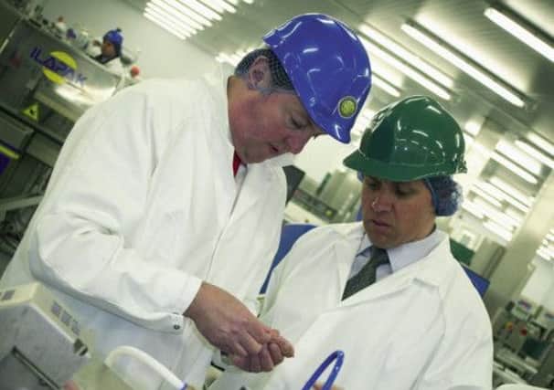 Sainsbury CEO Justin King (right) visits Cranswick's plant