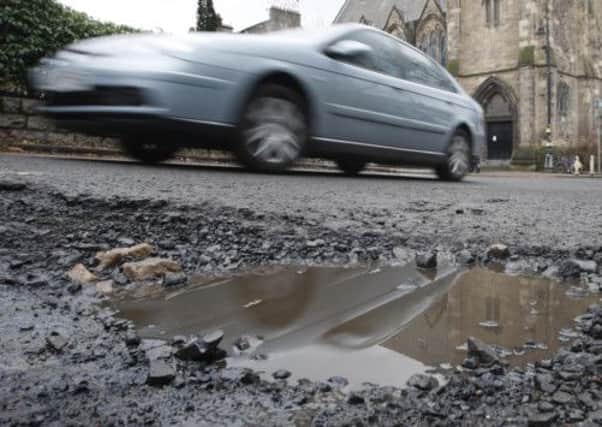 Britain's potholes now collectively measure 295 square miles -  twice the size of the Isle of Wight.