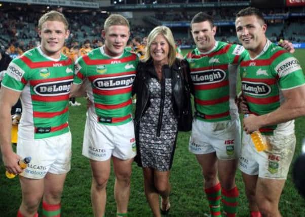 Burgess brothers, from left, Thomas, George, Luke and Sam, pose for a photo with their mother, Julie.