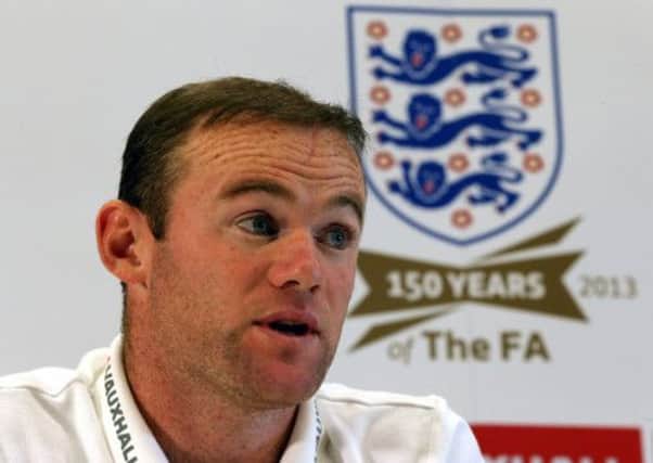 England's Wayne Rooney speaks during a press conference at St George's Park, Burton