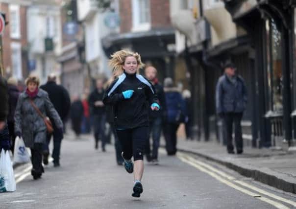 Rebecca Tomlinson runs through the streets of  York at the launch of the Yorkshire Marathon.
