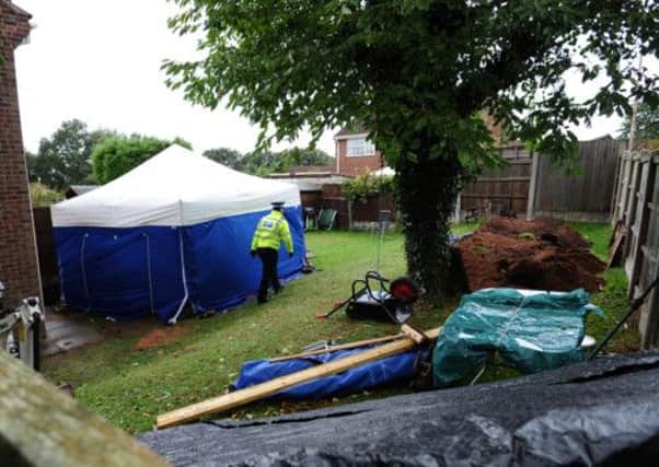 A police tent in the garden of a house in Forest Town, near Mansfield