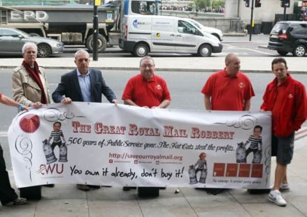 Postal workers protest outside Portcullis House in London against Royal Mail privatisation
