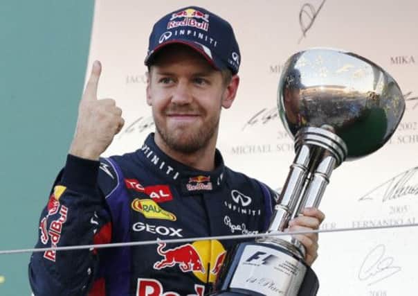 Red Bull driver Sebastian Vettel of Germany celebrates after winning