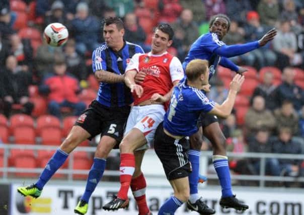 Bradley finds himself outnumbered by the Swindon defence