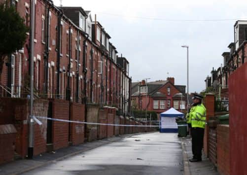 Police at the scene in Back Hill Top Avenue in the Harehills area of Leeds