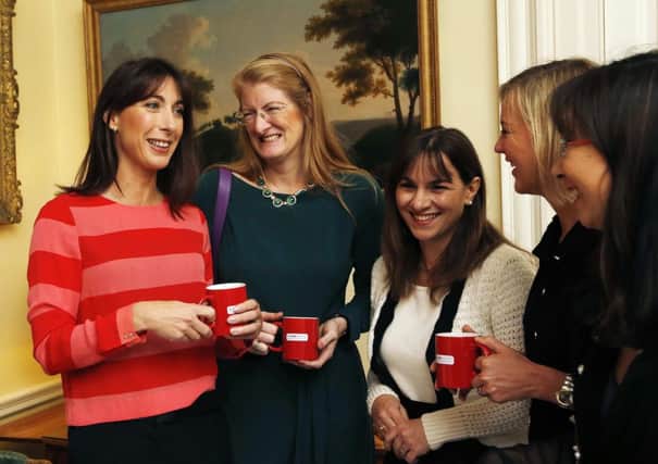 Samantha Cameron, wife of  Prime Minister David Cameron, with new ambassadors of "Contact A Family", in Downing Street