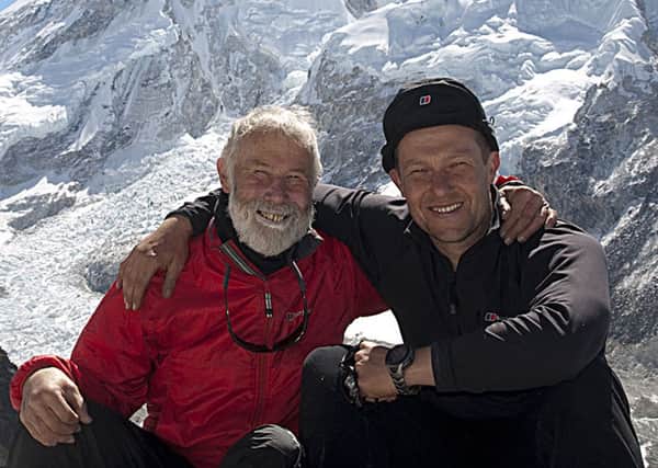 Sir Chris and eldest son Joe Bonington with Everest in the background