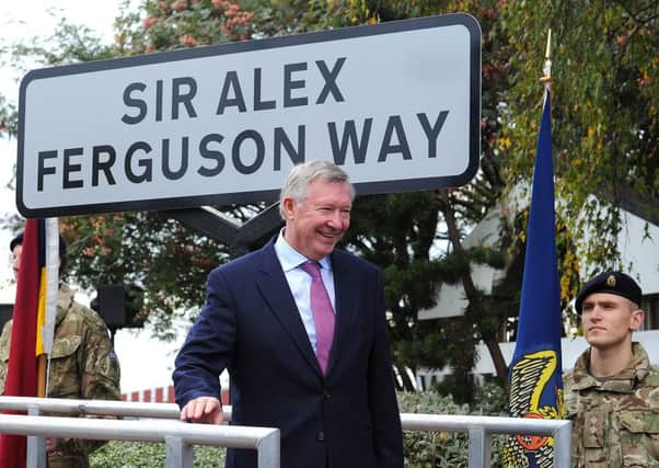 Sir Alex Ferguson unveils the street sign during a ceremony to mark the changing of the road name to Sir Alex Ferguson Way, Trafford.