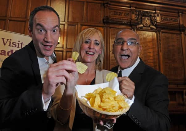 Visit Bradford's Tourism manager Patricia Tillotson lauches the curry crisp with Kevin Butterworth from Seabrook Crisps and Dill Butt from Akbars Restaurants at Bradford's 2013 Curry Capital Bid lauch event last week