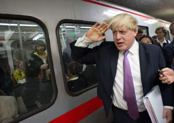Mayor of London Boris Johnson travels from Xidan to Gongzhufenin on Line 1 of the Beijing Metro