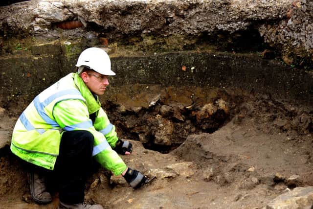Archaeologist Toby Kendall  Field  working within one of the walls of   the remains of St John The Baptist Church in Hungate.