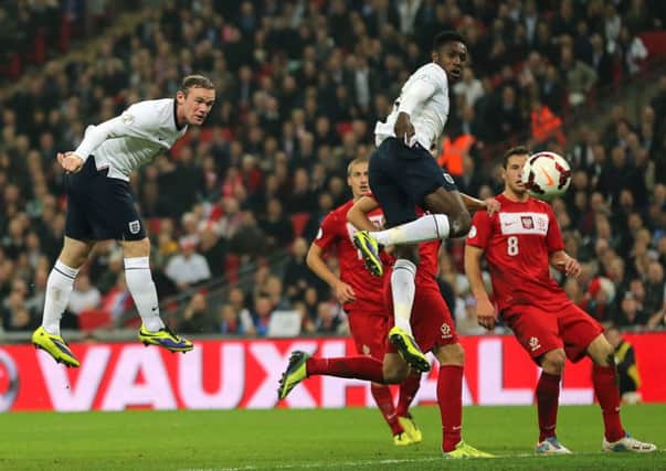England's Wayne Rooney scores his side's first goal of the game