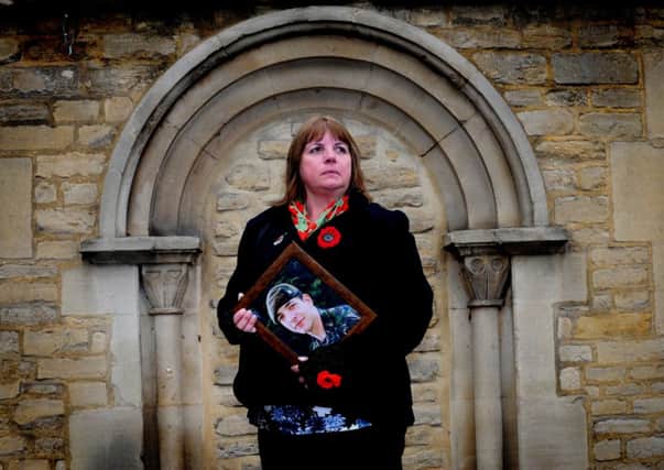 Monica Kershaw, mother of Pt Christopher Kershaw, holds a picture of her son at Oxford Coroner Court. Picture by Simon Hulme
