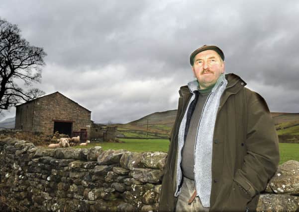 Farmer Tony Fawcett by the New Houses barn at Hardraw near Hawes