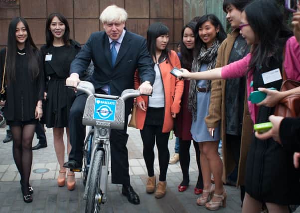 Mayor of London Boris Johnson on a  'Boris Bike' in Beijing.