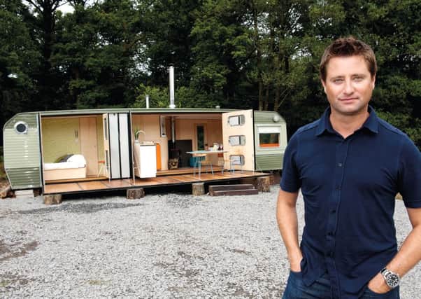 George Clarke with the caravan that he renovated.