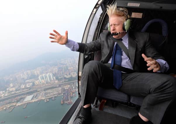 Mayor of London Boris Johnson takes a helicopter ride over Hong Kong