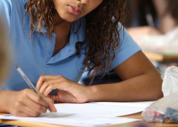 Fewer teenagers scored at least five Cs including English and maths in their GCSEs this year, official figures show.
