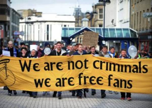 Fans protest at the police restrictions