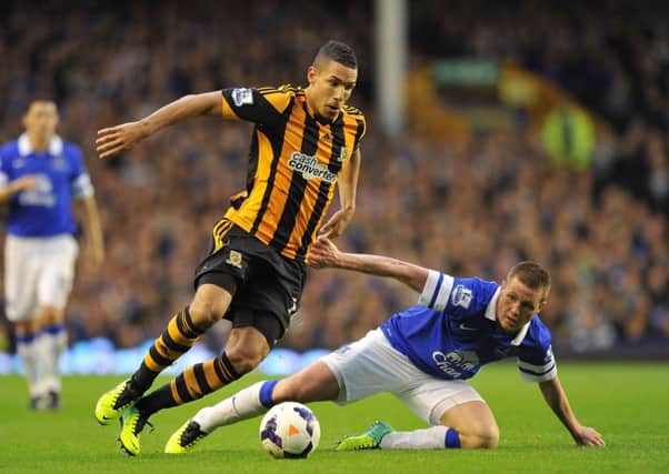 Hull City's Jake Livermore (left) and Everton's James McCarthy battle for the ball.