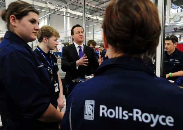 Prime Minister David Cameron meets apprentices during a visit to Rolls Royce Learning and Career Development Centre at Derby