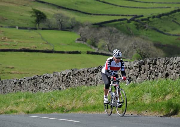 Ex-professional rider Barry Hoban climbs up Kidstones Pass, which will form part of  the first stage of the 2014 Tour de France