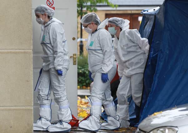 Crime Scene Investigators arriving at the address on the Phoenix Boulevard estate. Picture: Ross Parry Agency