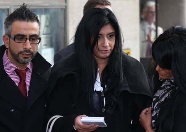 The family of Mohammed Saleem (left to right) Hanif Khan, Shazia Khan, Massarrat Saleem, read a statement outside the Old Bailey