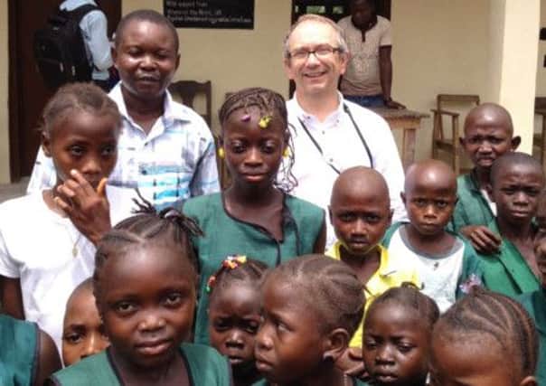 Gordon Milne and children in Sierra Leone