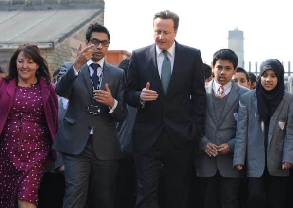 David Cameron meets headteacher Sajid Hussain at Kings Science Academy last year