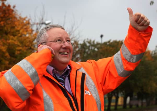Worker Eddie Heaney celebrates after an announcement by owners Ineos to keep the Grangemouth petrochemical site open
