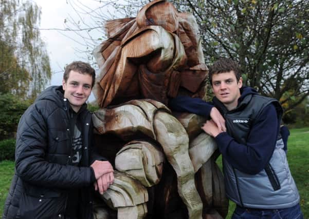 Alistair and Jonny Brownlee by The Griathlon sculpture at Bramhope