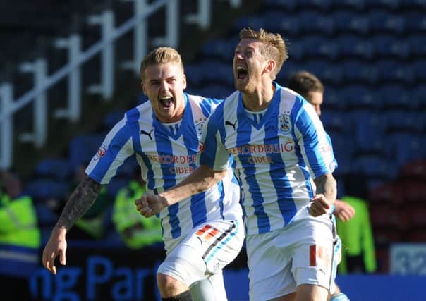 Huddersfield's Jonathan Stead celebrates his winning goal with Danny Ward.
